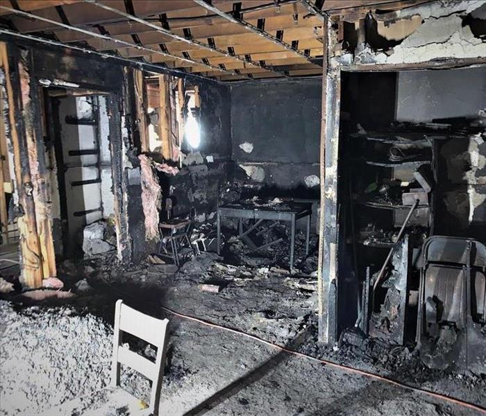 a fire damaged apartment with everything in the room charred and burnt
