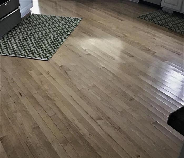 buckled wood floors from washing machine water overflow 