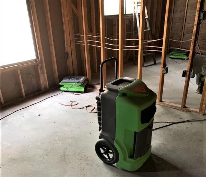 an apartment with exposed walls & newly installed insulation with servpro equipment