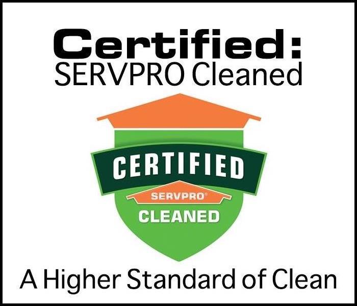 certified servpro cleaned logo decal attached to a business window