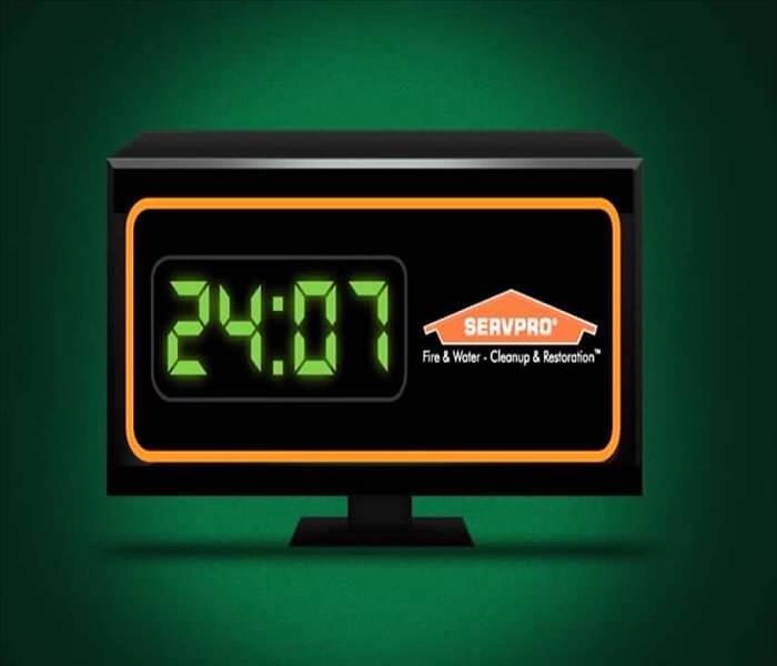 a clock with time reading 24:07 and a SERVPRO logo 