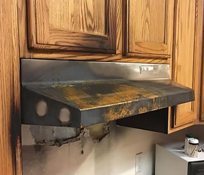 fire damages kitchen appliances and cabinets
