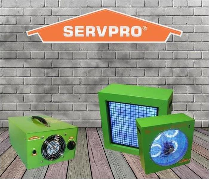 3 green ozone machines with an animated brick background with SERVPRO logo
