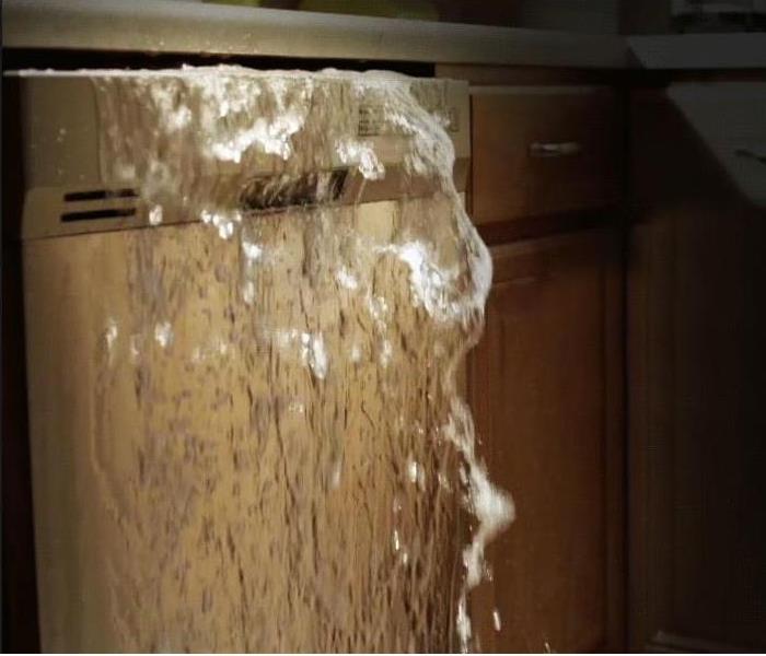 a dishwasher with water flowing out